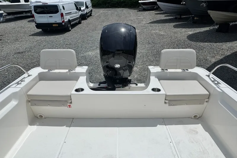 Slide: The Image of The image shows the stern of a Boston Whaler 190 Montauk with an outboard motor. - 5