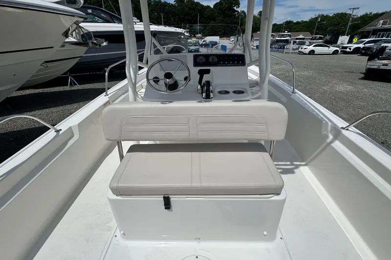 Slide: The Image of The image shows the cockpit of a Boston Whaler 190 Montauk with a white seat and helm console. - 8
