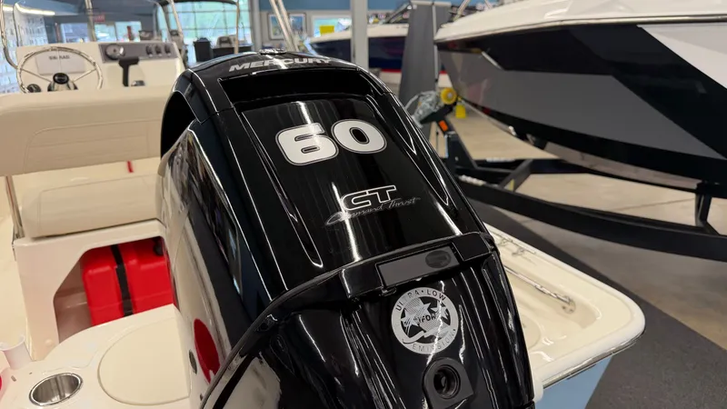 Slide: The Image of A Mercury 60 HP outboard motor is mounted on a Boston Whaler 150 Montauk boat. - 10