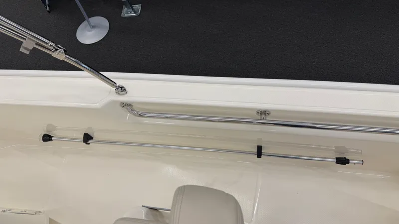 Slide: The Image of Close-up of a boat railing and fishing rod holder on a Boston Whaler 150 Montauk. - 16