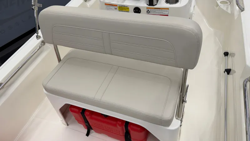Slide: The Image of The 2026 Boston Whaler 150 Montauk features a cushioned bench seat with storage underneath. - 19