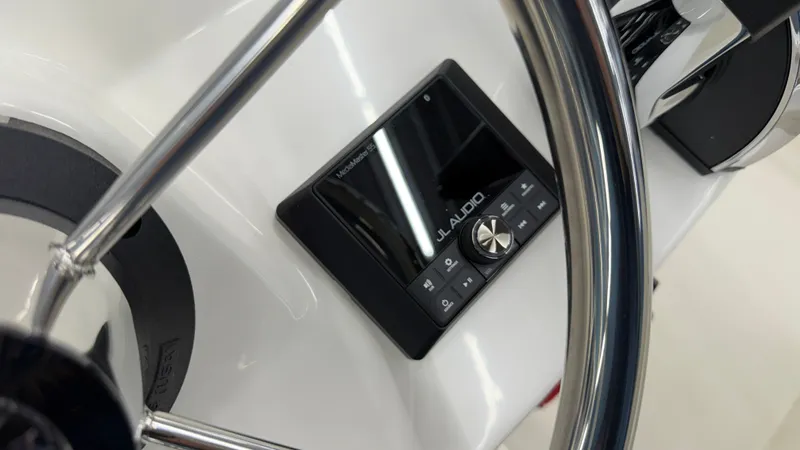 Slide: The Image of Close-up of a boat helm with JL Audio system. - 26