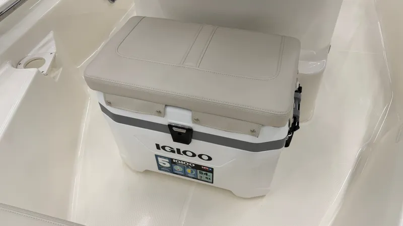 Slide: The Image of An Igloo cooler with a padded seat on a boat. - 35