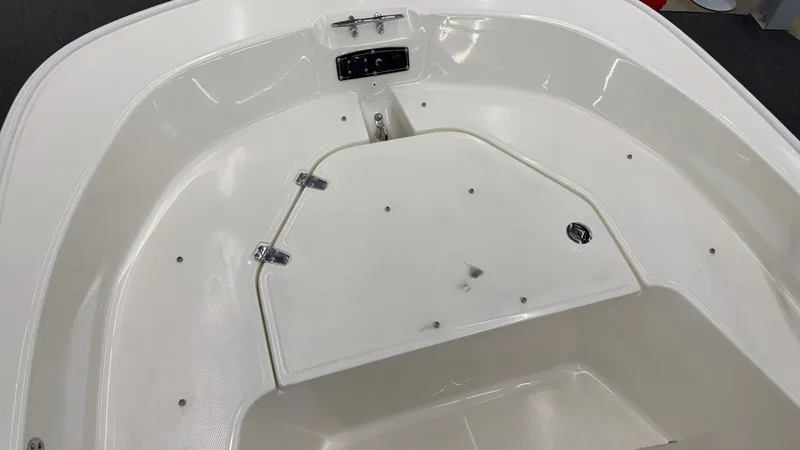 Slide: The Image of Bow area of a Boston Whaler 150 Montauk with storage and control panel. - 37