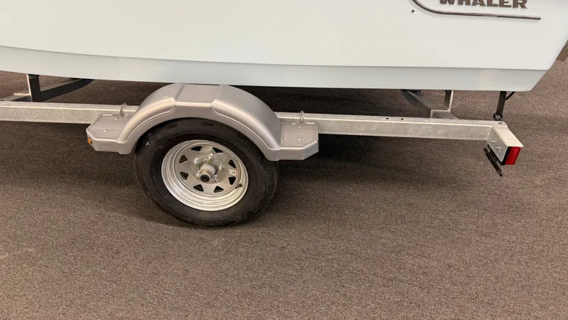 Slide: The Image of A boat trailer with one wheel and part of the boat hull is visible. - 41