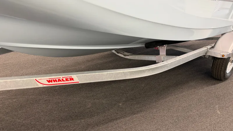 Slide: The Image of Close-up of a boat trailer with a Boston Whaler 150 Montauk boat on it. - 42