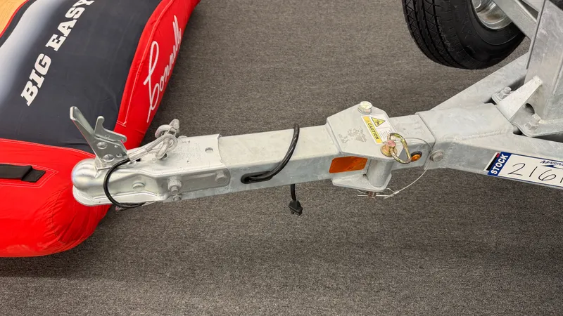 Slide: The Image of Close-up of a boat trailer hitch with safety chains and cables. - 44