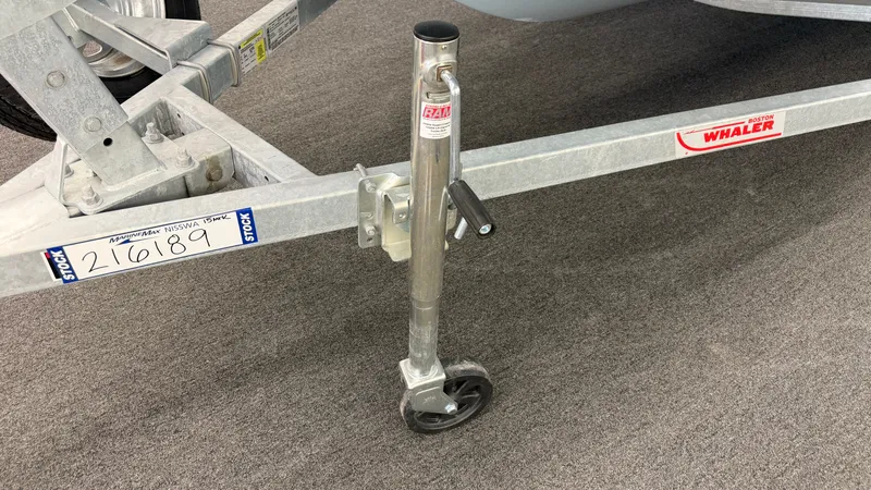 Slide: The Image of A boat trailer with a jack stand and a Boston Whaler logo. - 45