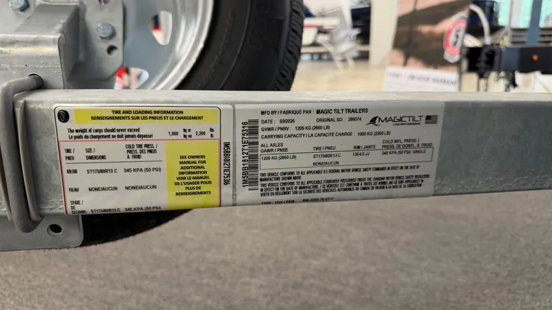 Slide: The Image of Close-up of a boat trailer with warning and loading information. - 48