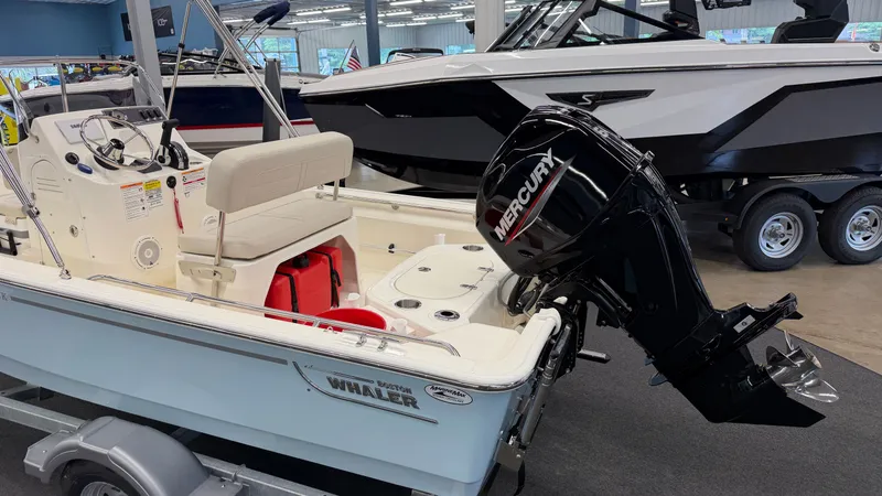 Slide: The Image of Boston Whaler 150 Montauk from 2026 in a showroom. - 6