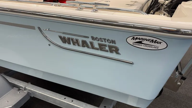 Slide: The Image of Close-up of the Boston Whaler 150 Montauk with MarineMax logo. - 7