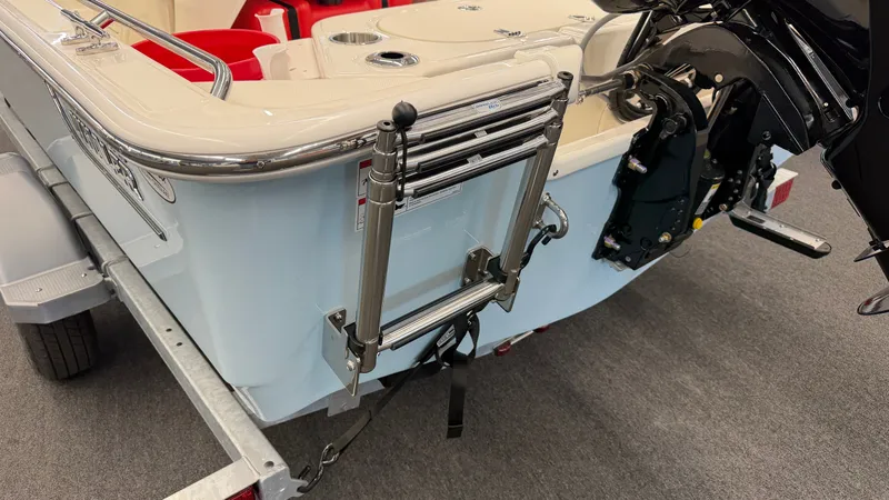 Slide: The Image of The 2026 Boston Whaler 150 Montauk features a swim ladder at the stern. - 8