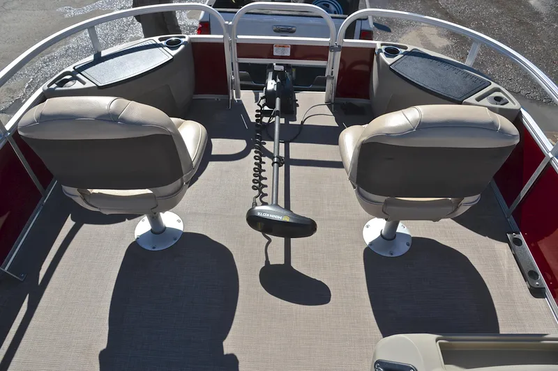 Slide: The Image of 2024 Sun Tracker Bass Buggy 18 DLX interior with two seats and steering console. - 21