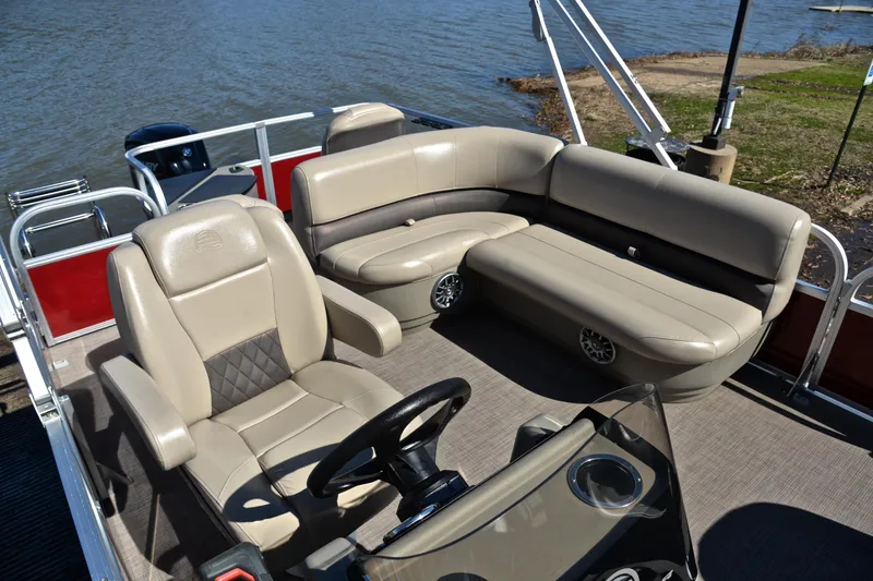 Slide: The Image of 2024 Sun Tracker Bass Buggy 18 DLX pontoon boat interior with beige seating. - 23