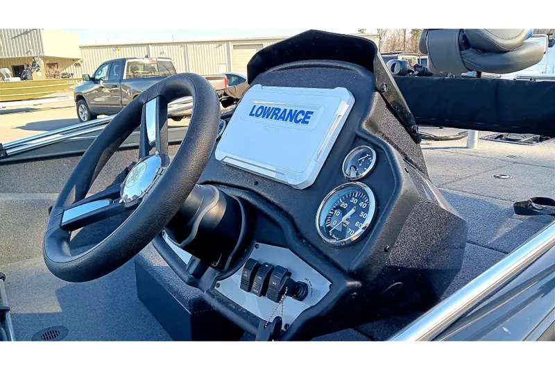 Slide: The Image of 2025 Ranger RT188P boat dashboard with steering wheel and Lowrance display. - 11