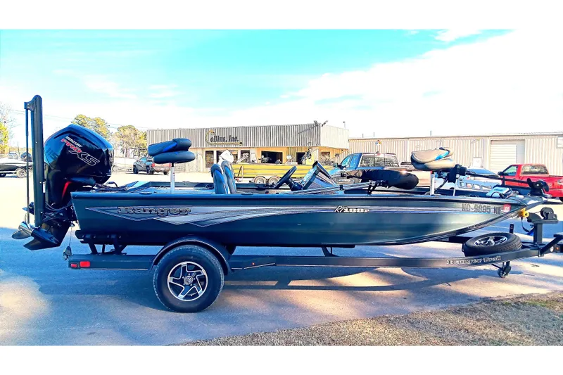 Slide: The Image of 2025 Ranger RT188P fishing boat on trailer, parked outdoors, side view. - 5