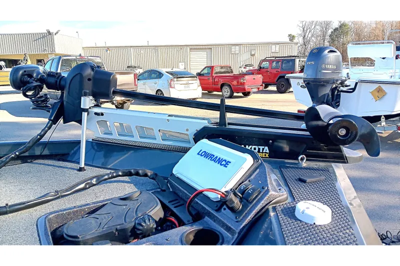 Slide: The Image of 2025 Ranger RT188P boat with Yamaha motor and Lowrance electronics in a parking lot. - 9