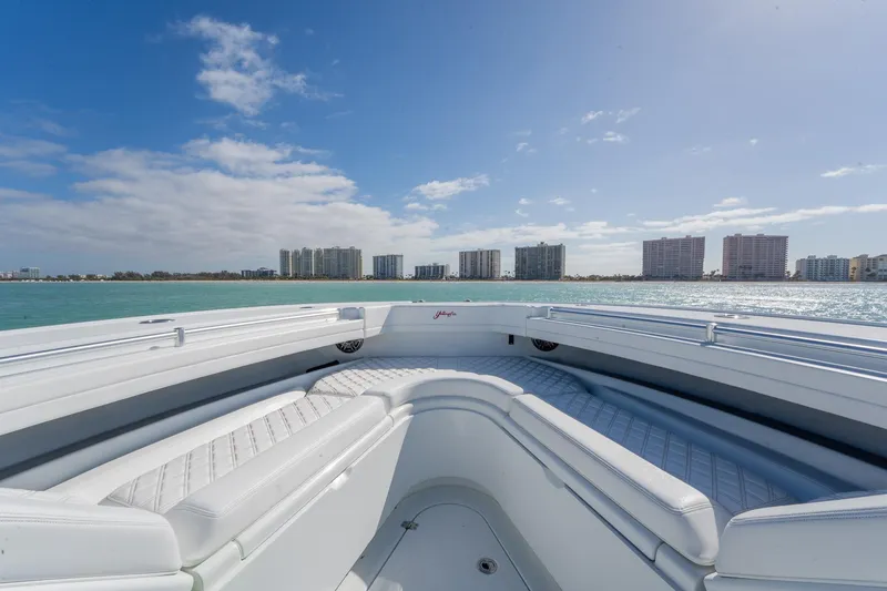 Slide: The Image of 2024 Yellowfin 42 Offshore boat interior with ocean view and city skyline. - 15