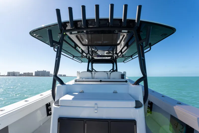 Slide: The Image of 2024 Yellowfin 42 Offshore boat on calm sea with clear blue sky. - 26