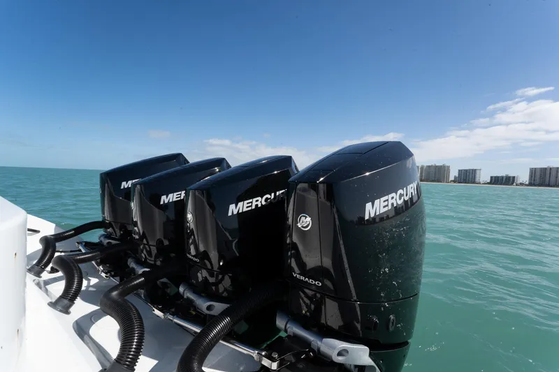 Slide: The Image of 2024 Yellowfin 42 Offshore boat with four Mercury Verado engines on open water. - 32