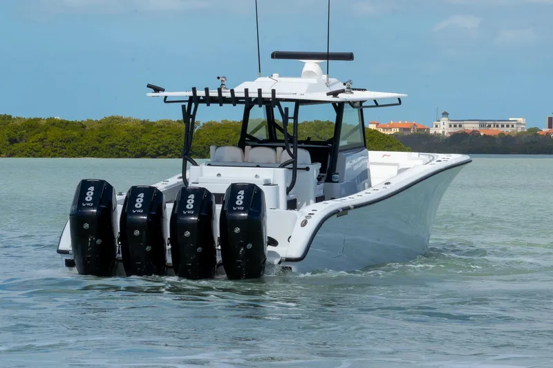 Slide: The Image of 2024 Yellowfin 42 Offshore boat with quad 400 V10 engines on calm water. - 8