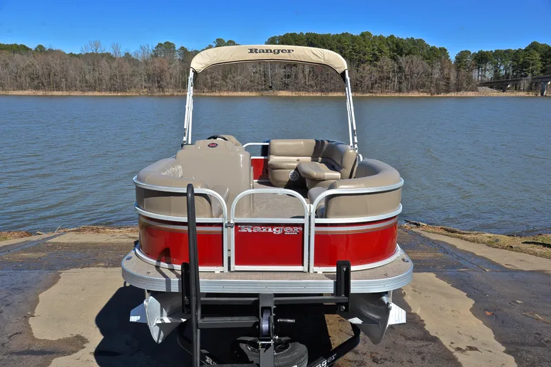 Slide: The Image of 2021 Ranger 180 Reata boat on trailer by a scenic lake. - 17