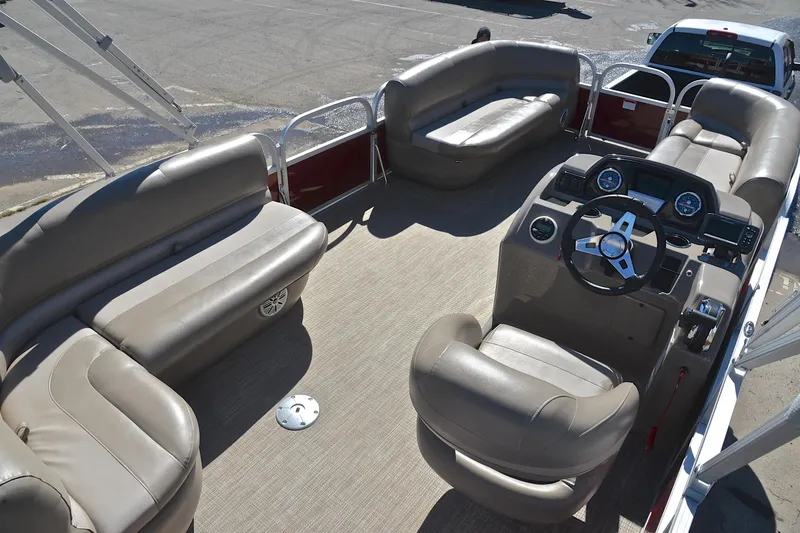 Slide: The Image of 2021 Ranger 180 Reata boat interior with spacious seating and modern dashboard. - 19