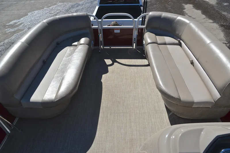 Slide: The Image of 2021 Ranger 180 Reata boat interior with beige seating and carpeted floor. - 21