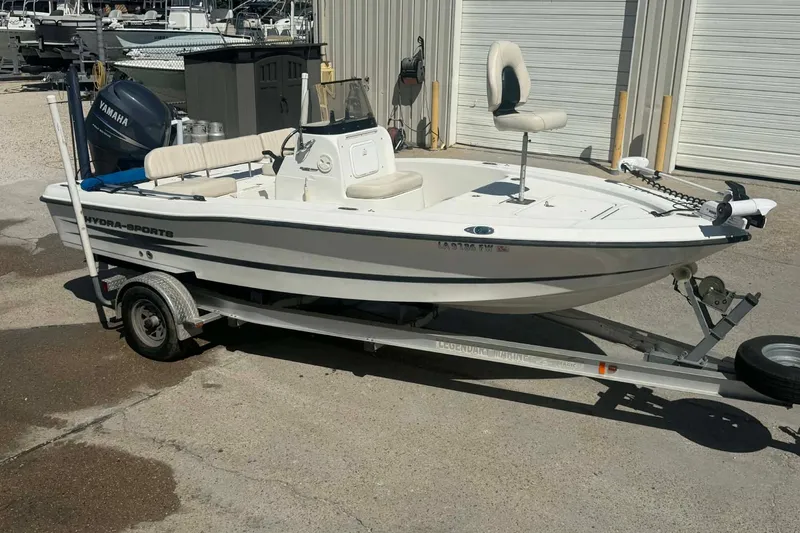 Slide: The Image of 2010 Hydra-Sports Bay Bolt 19 boat on trailer, parked outdoors. - 0
