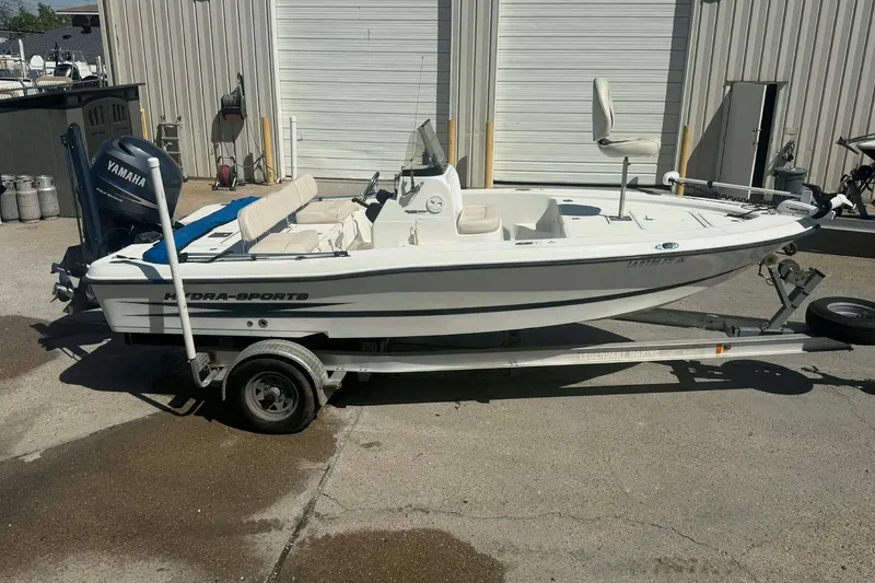 Slide: The Image of 2010 Hydra-Sports Bay Bolt 19 boat on trailer, equipped with Yamaha outboard motor. - 1