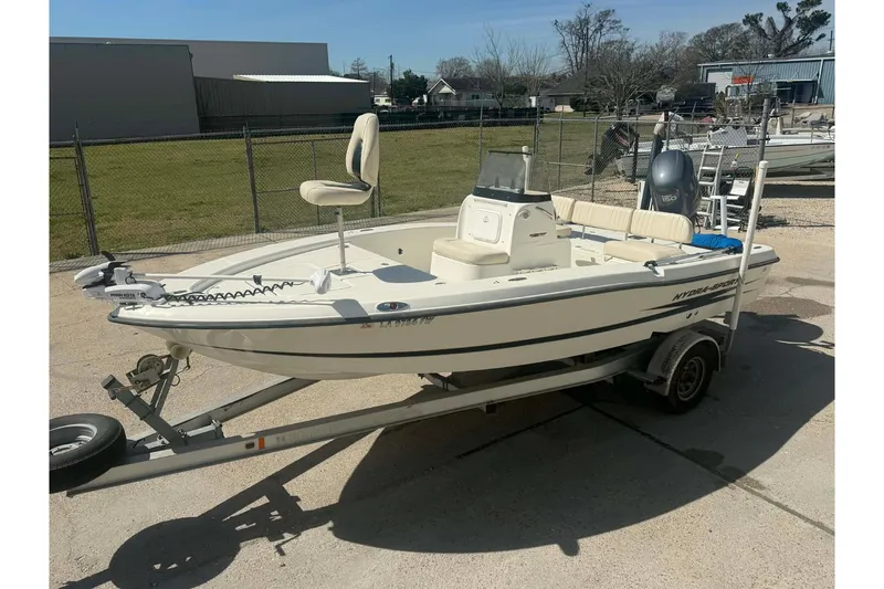 Slide: The Image of 2010 Hydra-Sports Bay Bolt 19 boat on trailer, parked outdoors. - 2