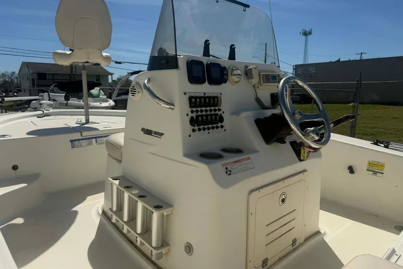 Slide: The Image of 2010 Hydra-Sports Bay Bolt 19 boat interior with steering console and seating. - 3