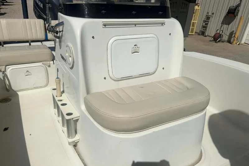 Slide: The Image of 2010 Hydra-Sports Bay Bolt 19 boat interior with beige seating and storage compartments. - 7