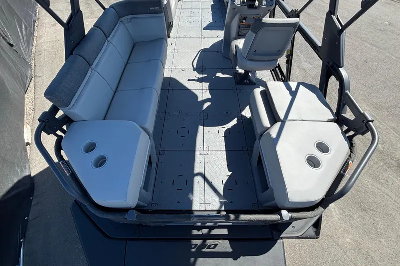 Slide: The Image of 2023 Sea-Doo Switch Cruise 21 pontoon boat with spacious seating and canopy. - 11