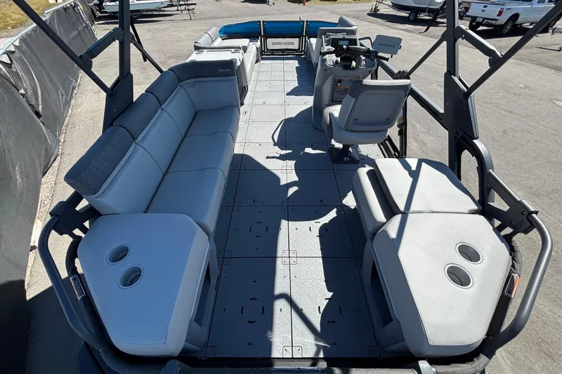 Slide: The Image of 2023 Sea-Doo Switch Cruise 21 pontoon boat with spacious seating and canopy. - 12