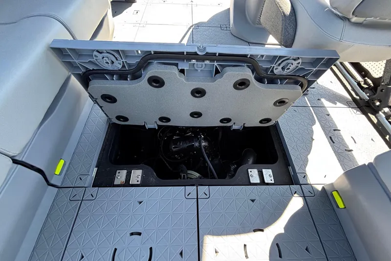 Slide: The Image of 2023 Sea-Doo Switch Cruise 21 pontoon boat interior with seating and steering console. - 14