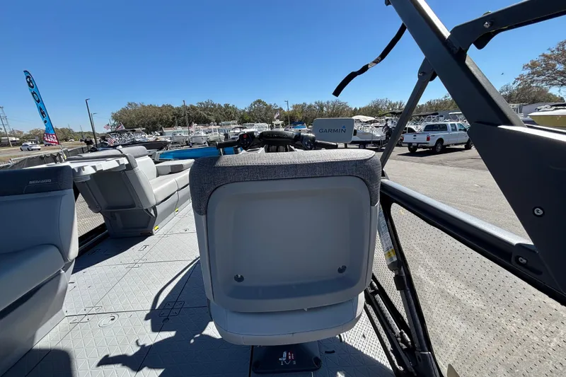 Slide: The Image of 2023 Sea-Doo Switch Cruise 21 interior with seating and Garmin navigation system. - 31