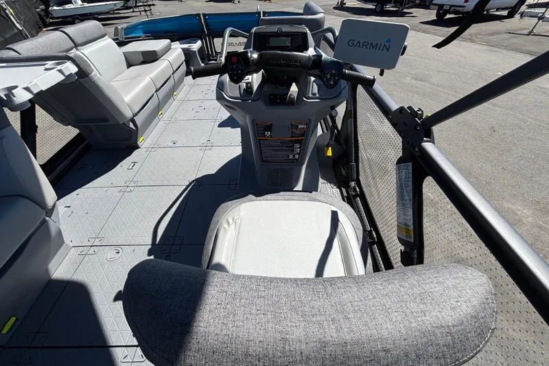 Slide: The Image of 2023 Sea-Doo Switch Cruise 21 interior with Garmin navigation, showcasing seating and controls. - 32