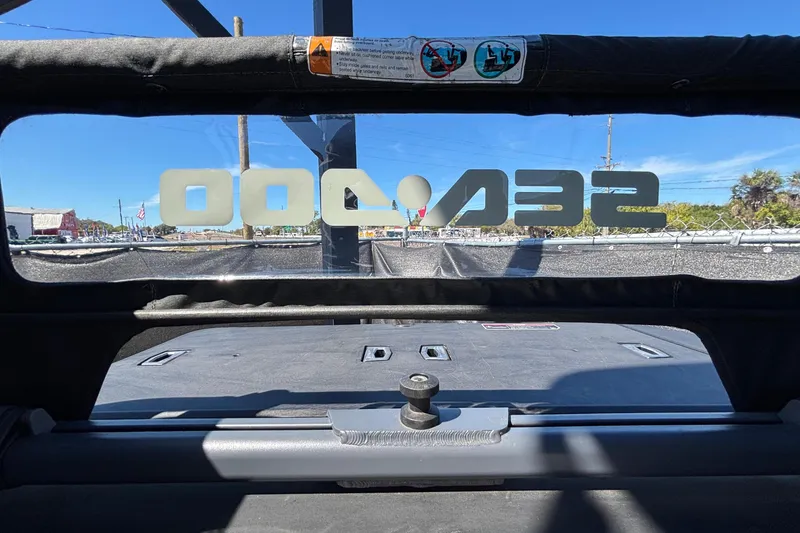 Slide: The Image of 2023 Sea-Doo Switch Cruise 21 interior view with logo and sunny background. - 50