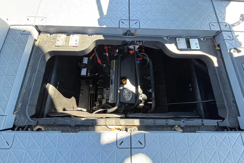 Slide: The Image of 2023 Sea-Doo Switch Cruise 21 engine compartment with visible Rotax engine. - 59