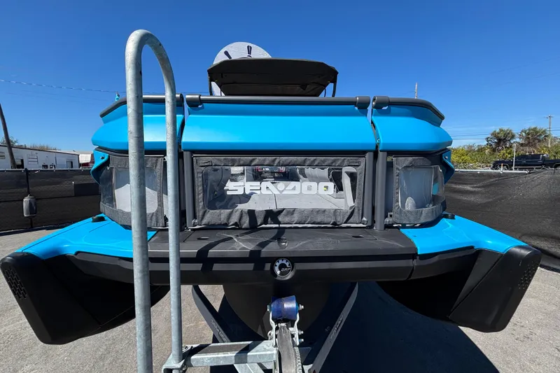 Slide: The Image of 2023 Sea-Doo Switch Cruise 21 pontoon boat on trailer, outdoor display. - 6