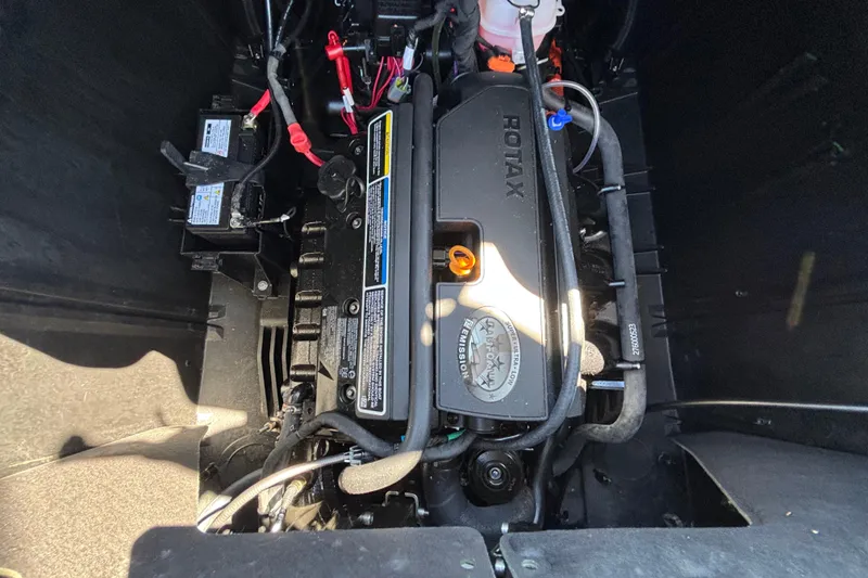 Slide: The Image of 2023 Sea-Doo Switch Cruise 21 engine compartment with Rotax motor and battery components. - 60