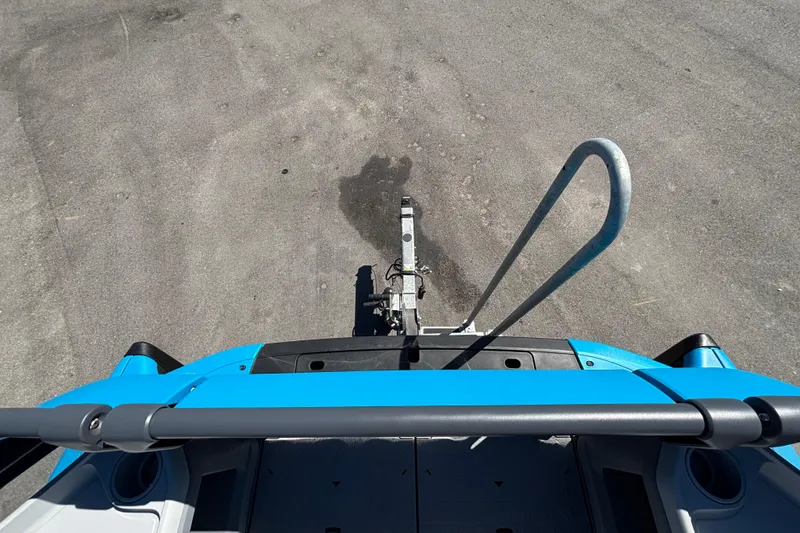 Slide: The Image of 2023 Sea-Doo Switch Cruise 21 dashboard with Garmin navigation system in a marina setting. - 62