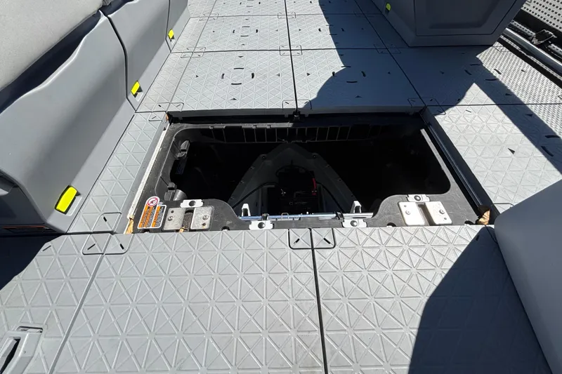 Slide: The Image of 2023 Sea-Doo Switch Cruise 21 deck with open storage compartment, showcasing interior features. - 69