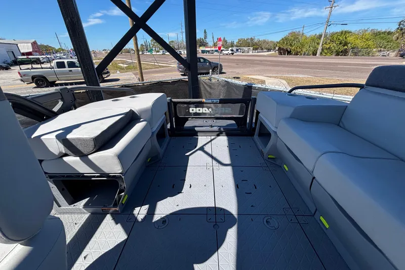 Slide: The Image of 2023 Sea-Doo Switch Cruise 21 interior storage compartment with seating and blue accents. - 74