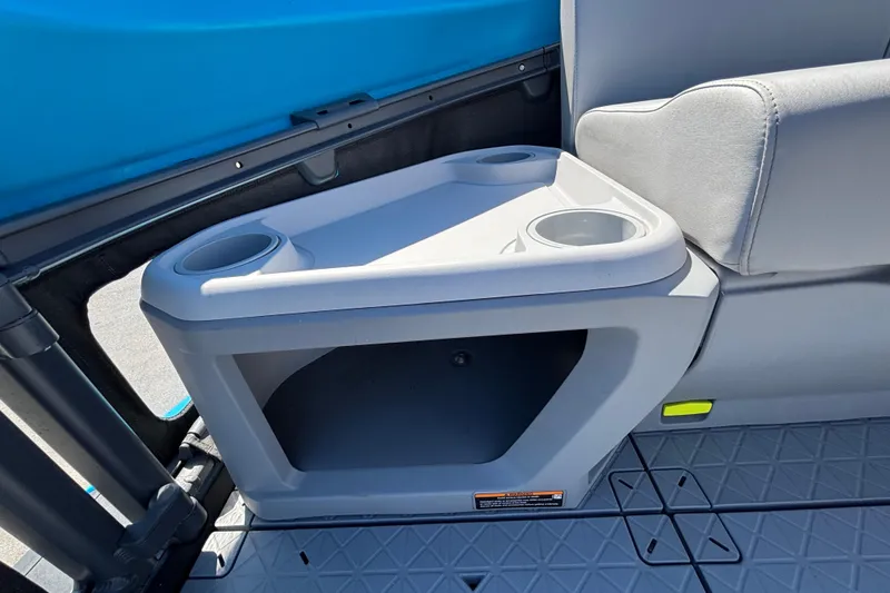 Slide: The Image of 2023 Sea-Doo Switch Cruise 21 interior with cup holders and storage compartment. - 76