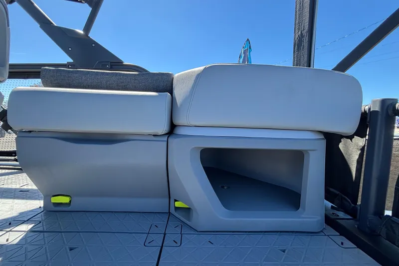 Slide: The Image of 2023 Sea-Doo Switch Cruise 21 interior with seating and table, surrounded by boats. - 79
