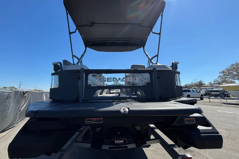 Slide: The Image of 2023 Sea-Doo Switch Cruise 21 boat, blue and white, parked on a trailer. - 8