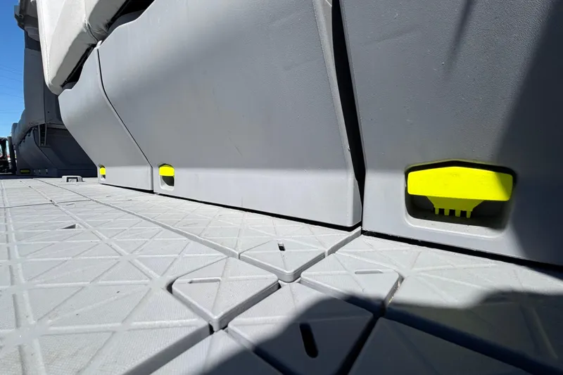 Slide: The Image of 2023 Sea-Doo Switch Cruise 21 deck with modular seating and bright yellow accents. - 88