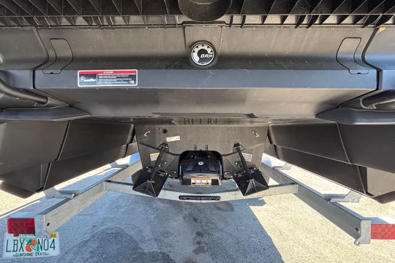 Slide: The Image of 2023 Sea-Doo Switch Cruise 21 on trailer, rear view, blue and black design. - 9